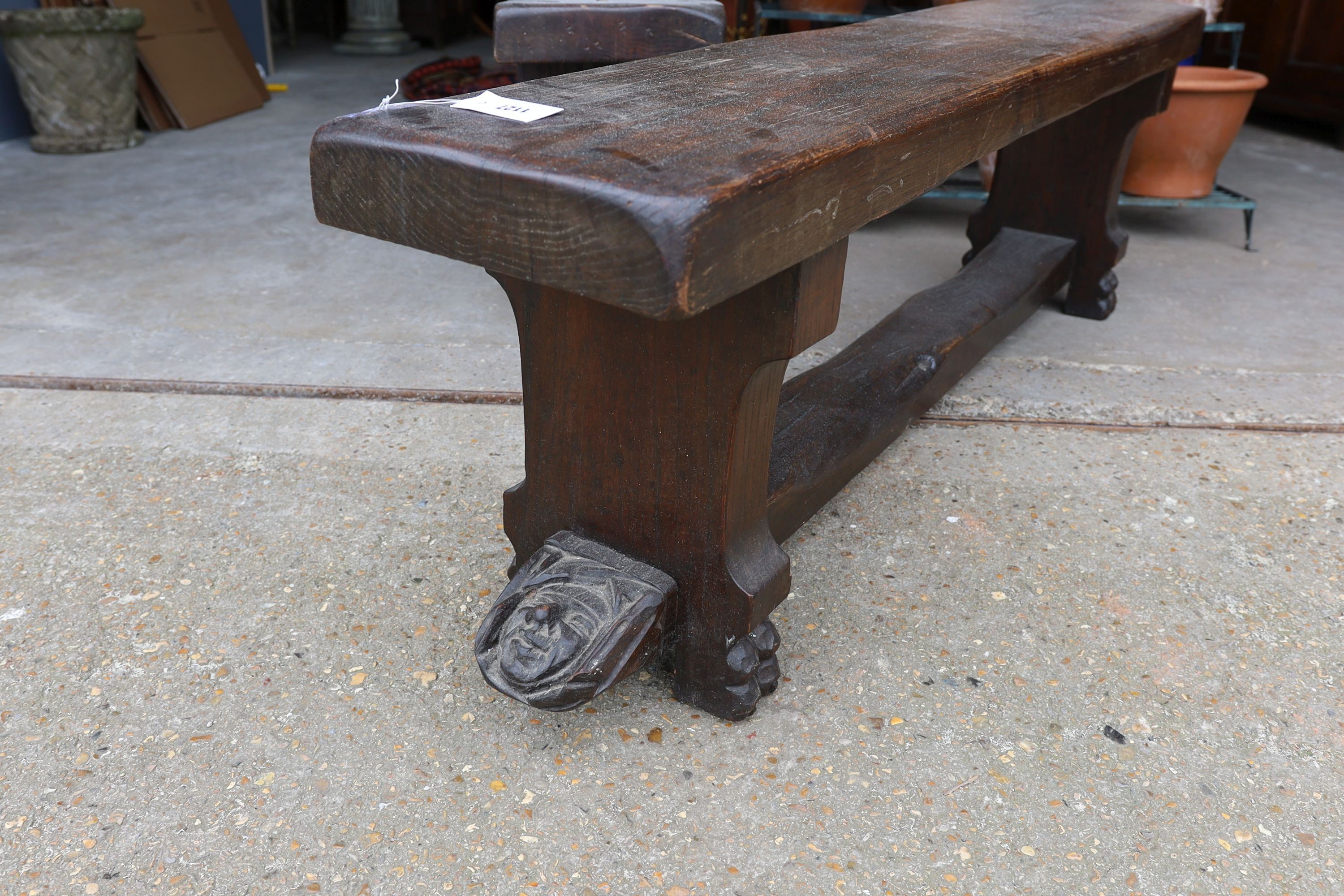 A pair of 17th century style carved oak New England benches, length 150cm, depth 28cm, height 46cm